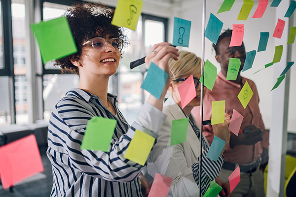 A graphic with a woman and sticky-notes
